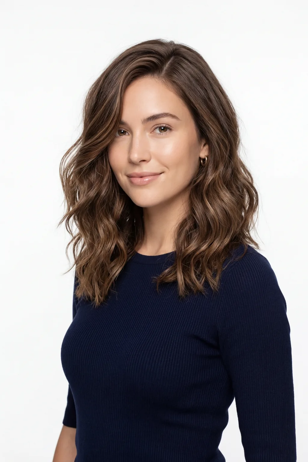 Woman with beachy tousled wavy lob styled with deep side part and natural undone texture